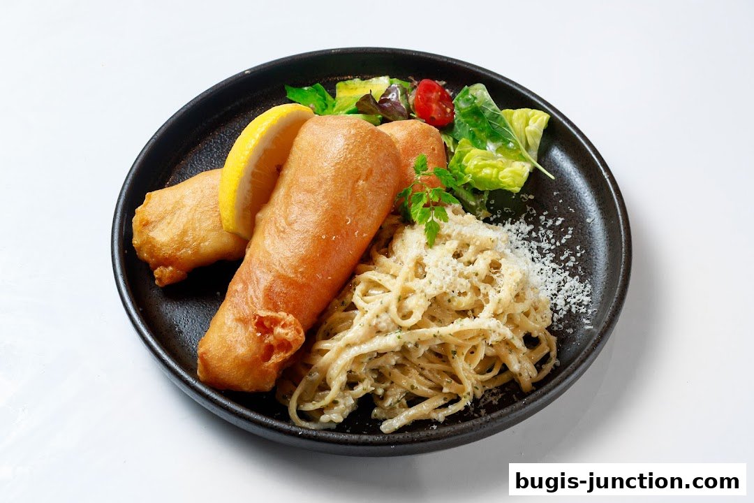 A plate of crispy fish and chips served with pasta and a side salad.