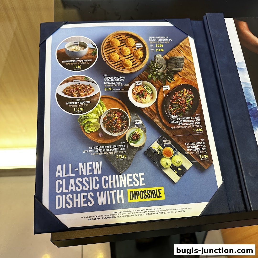 A menu showcasing classic Chinese dishes made with Impossible plant-based meat.