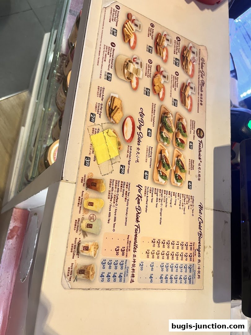 A menu from Ya Kun Kaya Toast featuring various toast, sides, and beverages.