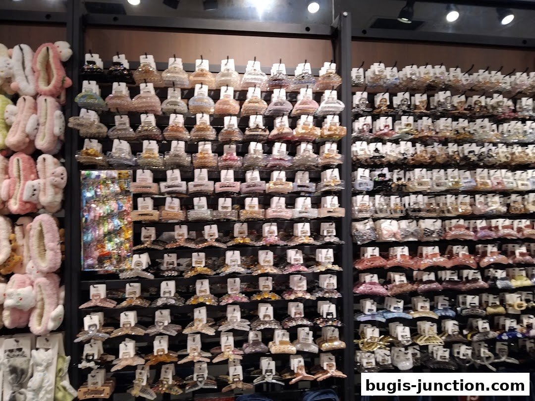 A wall display of various hair claw clips and fluffy hair accessories.