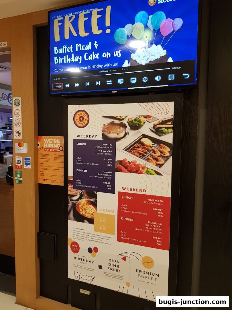A menu board for Seoul Garden featuring weekday and weekend buffet prices, soups, and birthday promotions.