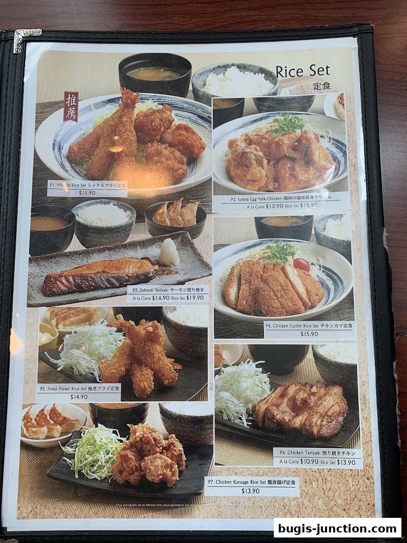 A menu featuring various Japanese rice sets with fried items and grilled options.