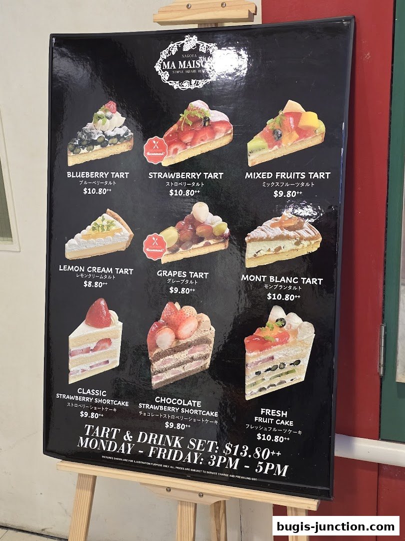 A menu board displaying various tarts and cakes with prices and descriptions.