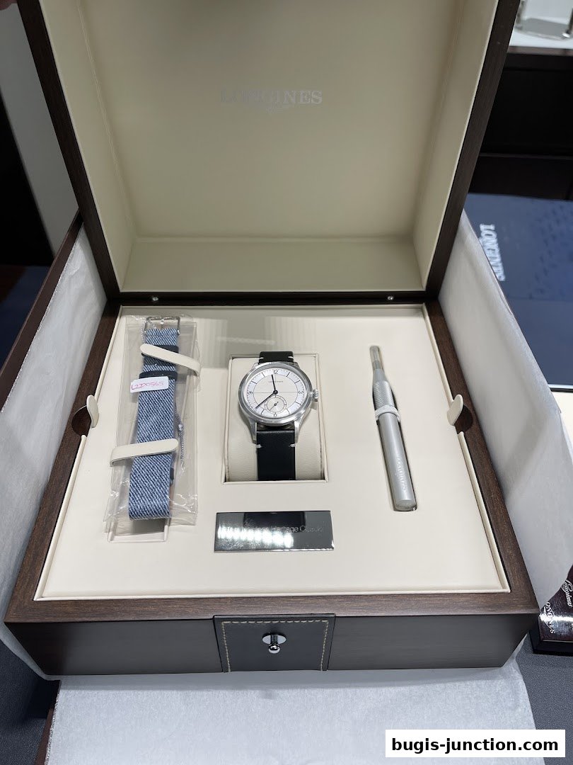 A Longines watch set with an extra strap and accessories in a presentation box.