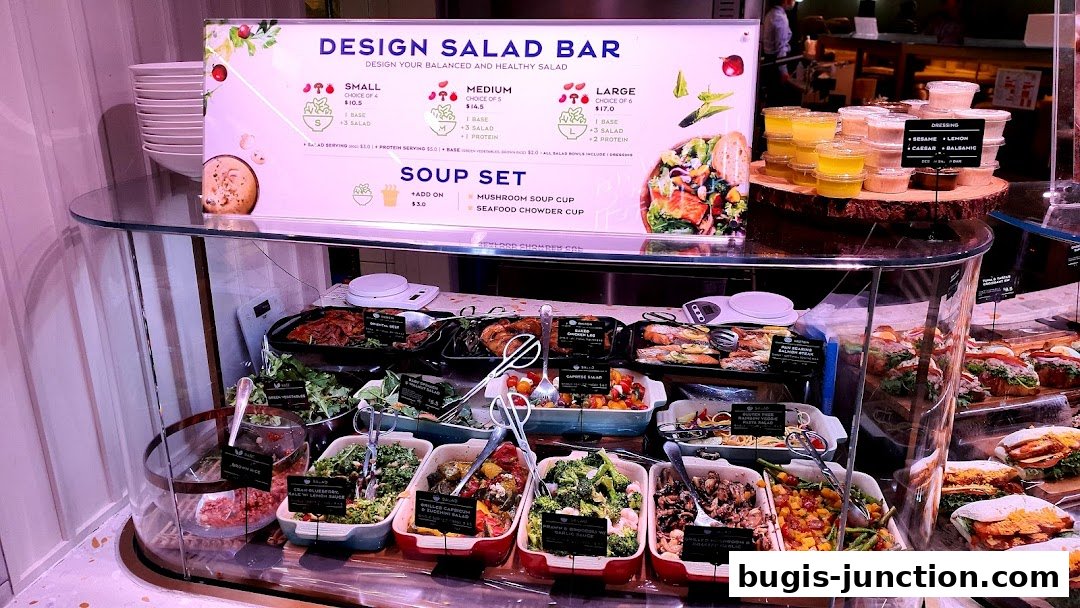 A display of fresh salads and soups with pricing and options.