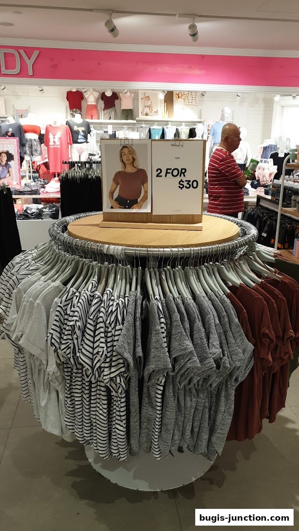 A display of t-shirts with a '2 for $30' promotion at Cotton On.