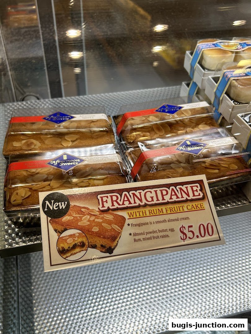 A display of individually packaged Frangipane with Rum Fruit Cake.