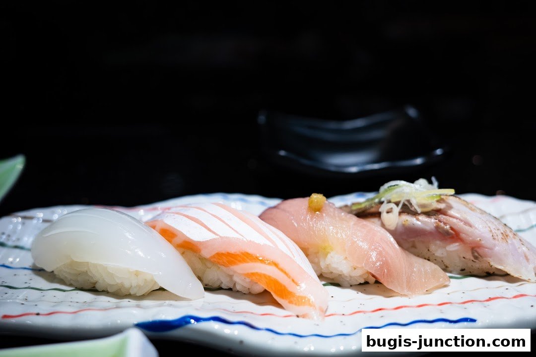 A close-up of a plate of assorted sushi with a dark background.