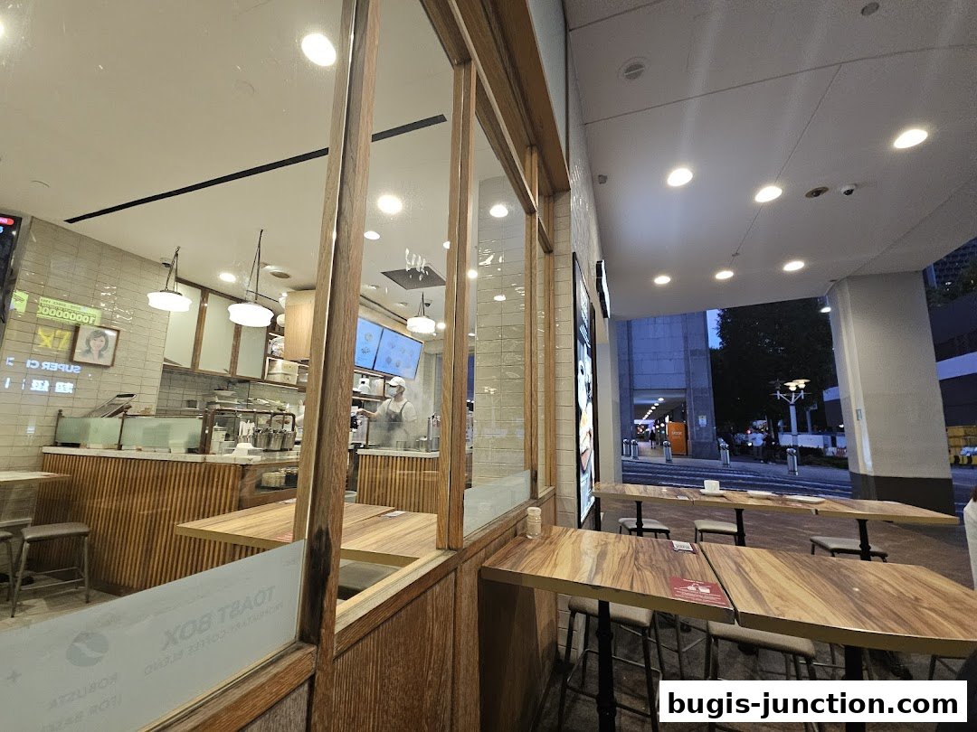 Interior view of Toast Box Bugis Junction with seating and counter area.
