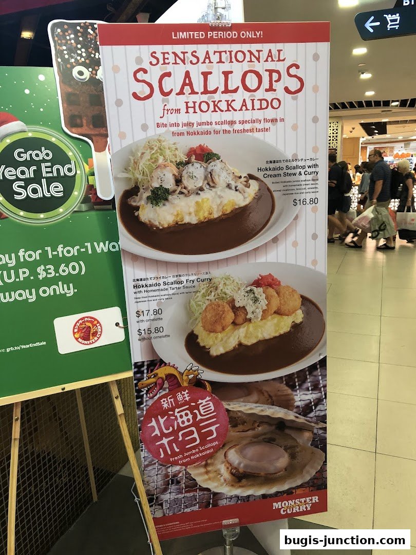 A promotional poster for Monster Curry featuring limited-period scallop dishes from Hokkaido.