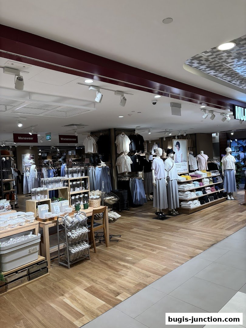 Interior view of MUJI Bugis Junction showcasing clothing and home goods displays.