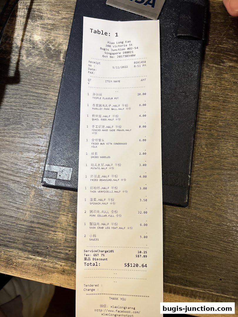 A receipt from Xiao Long Kan Hotpot showing a list of ordered items and their prices.