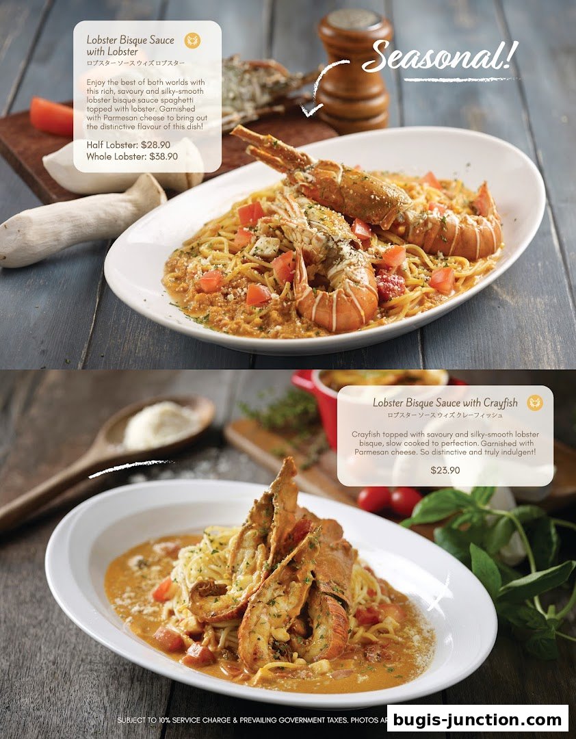 Two plates of lobster bisque spaghetti, one with lobster and one with crayfish.