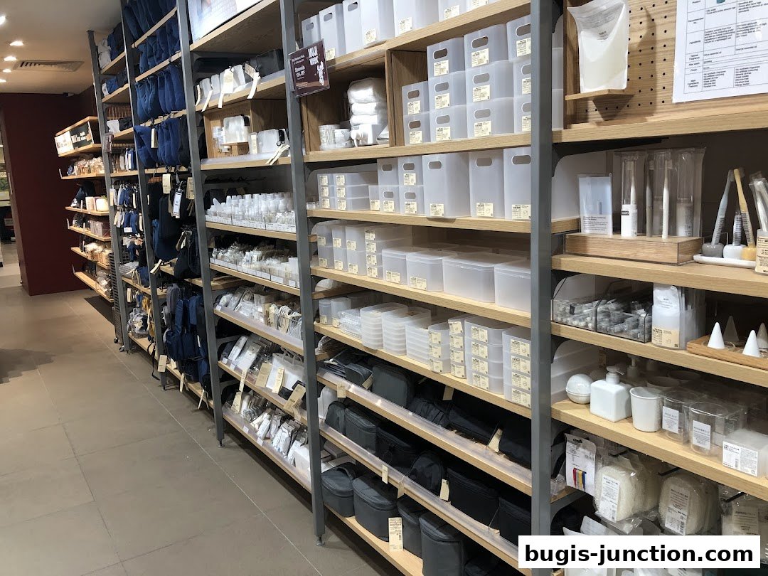 Shelves filled with various storage containers, bags, and personal care items at MUJI.