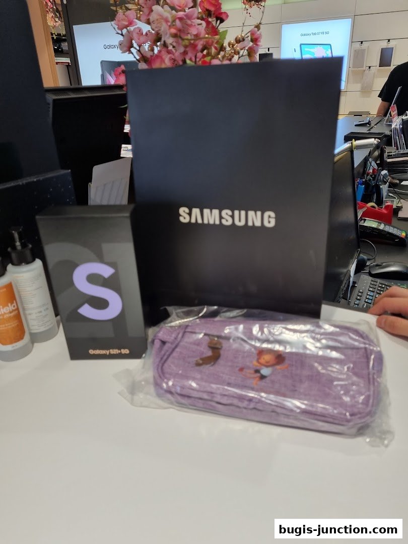 Samsung Galaxy S21+ 5G box and Samsung branded bag on a counter.