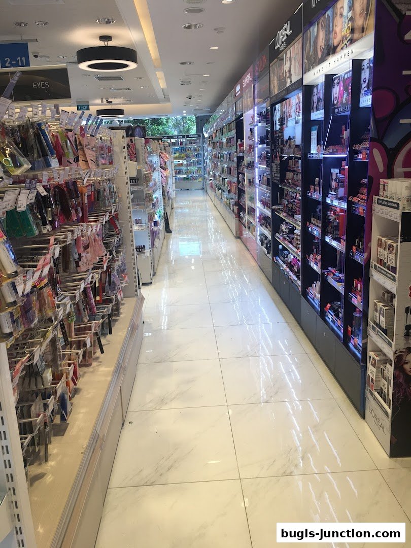 A well-lit beauty store aisle showcasing a wide variety of makeup and beauty products.
