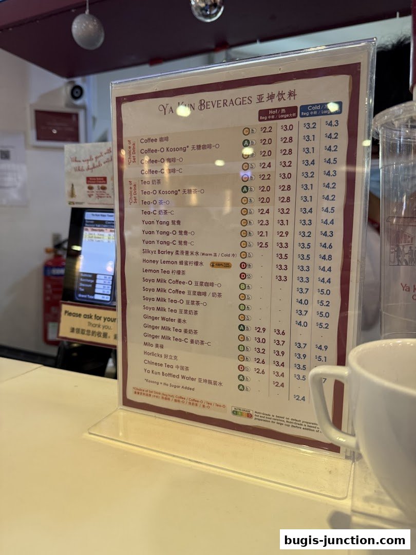 A menu board displaying beverages with prices for Ya Kun Kaya Toast.