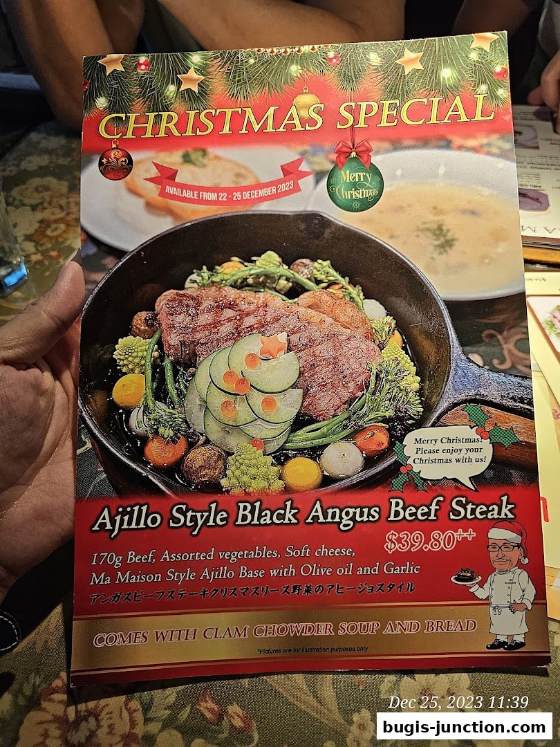 A Christmas special menu featuring Ajillo Style Black Angus Beef Steak.