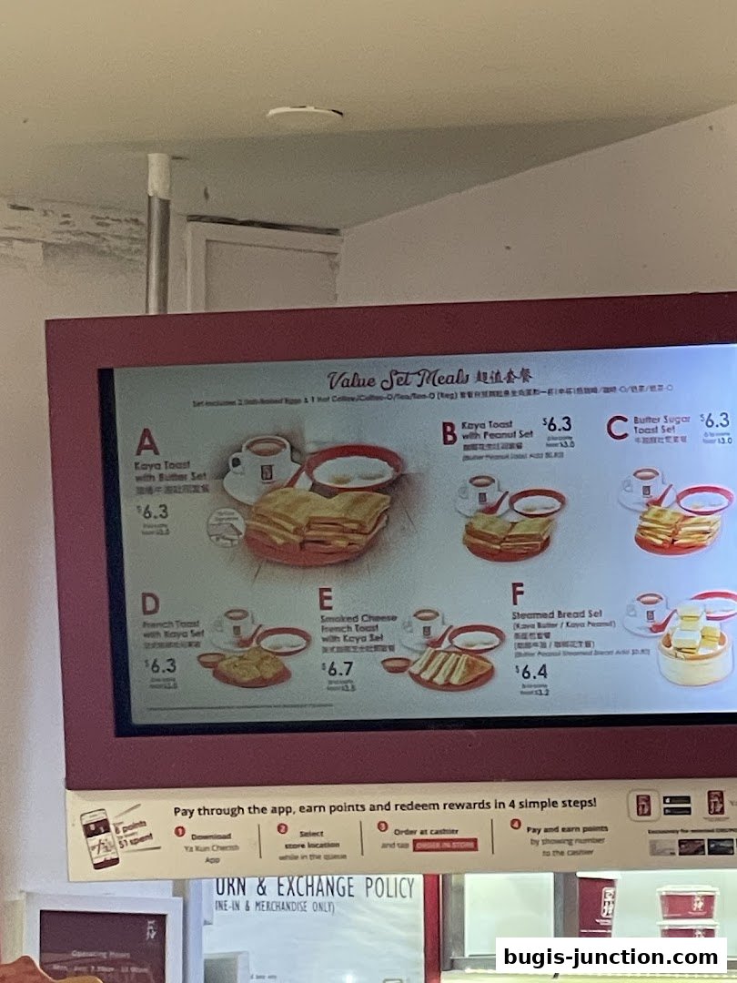 A digital menu board displaying various value set meals with images and prices.