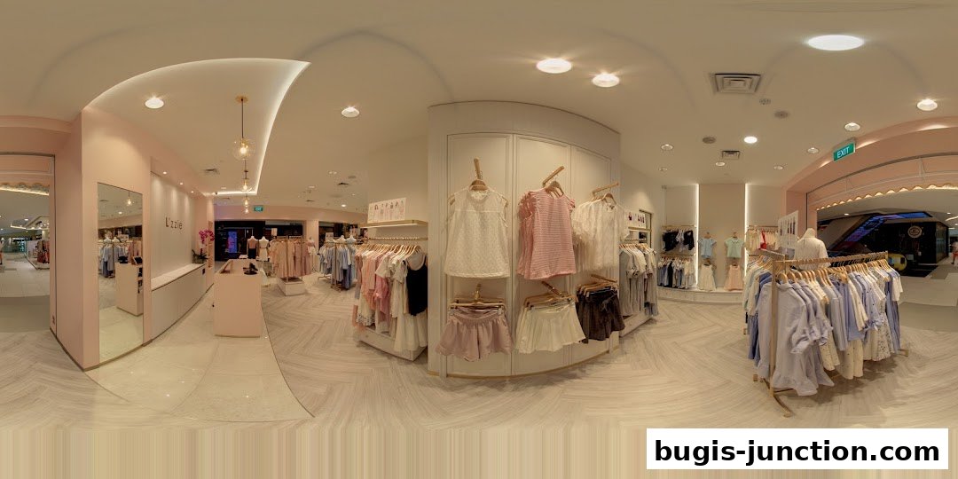 Interior view of a clothing store with racks of pastel-colored apparel and a clean, modern design.