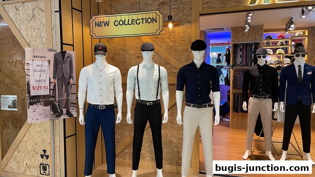 Mannequins display stylish outfits from RECOIL, featuring a new collection of blazers and pants.