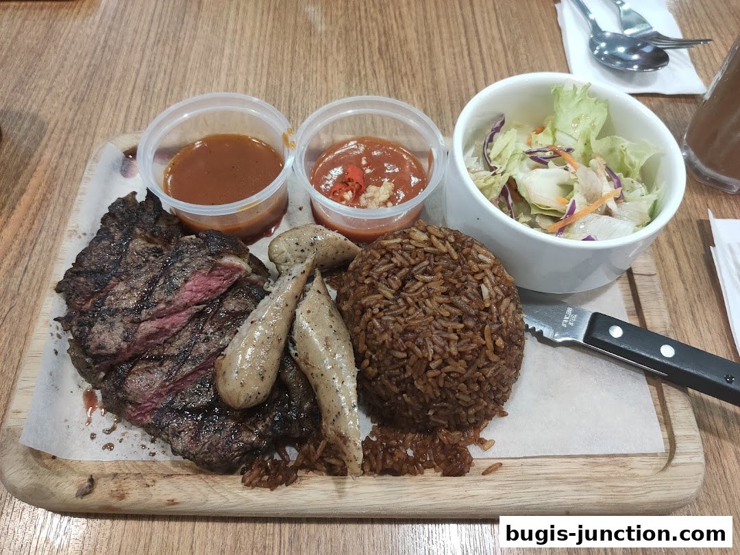A juicy steak with rice, salad, and sauces served on a wooden platter.