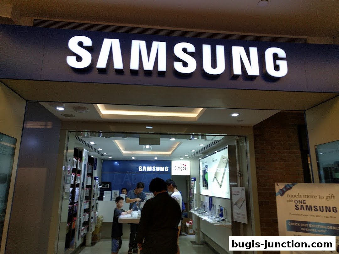 The entrance to a Samsung Experience Store with a large illuminated Samsung sign above.