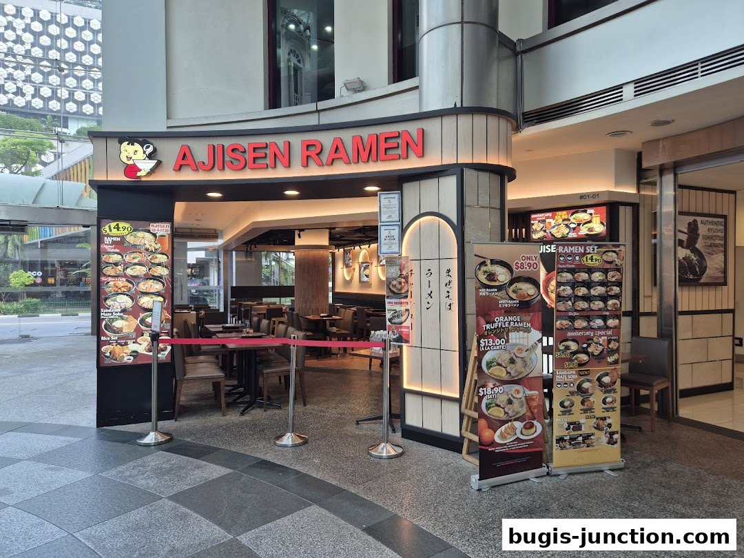 The exterior of Ajisen Ramen Bugis Junction with menus displayed outside.