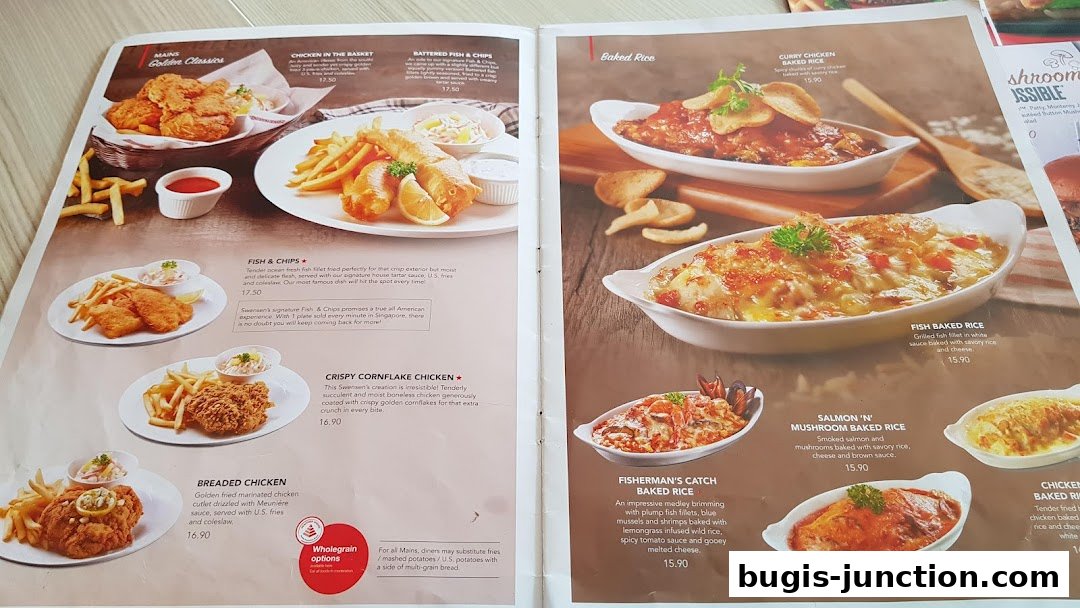 A menu from Swensen's featuring various main courses like fish and chips, fried chicken, and baked rice dishes.