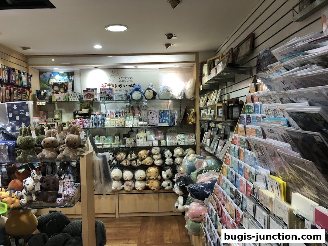 Interior view of a stationery and gift shop with plush toys and greeting cards.