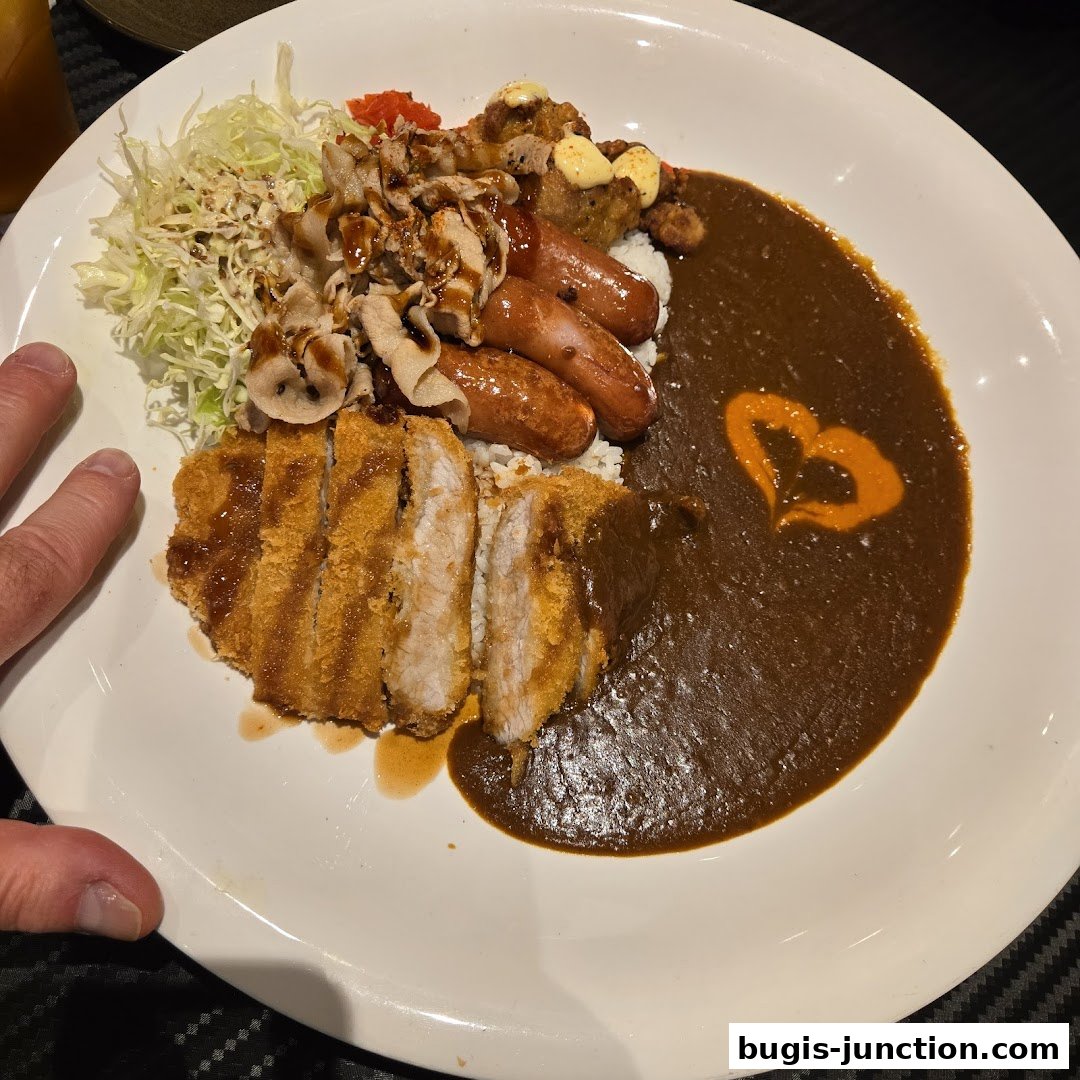 A hearty Japanese curry dish with katsu, sausages, and pork slices on rice.