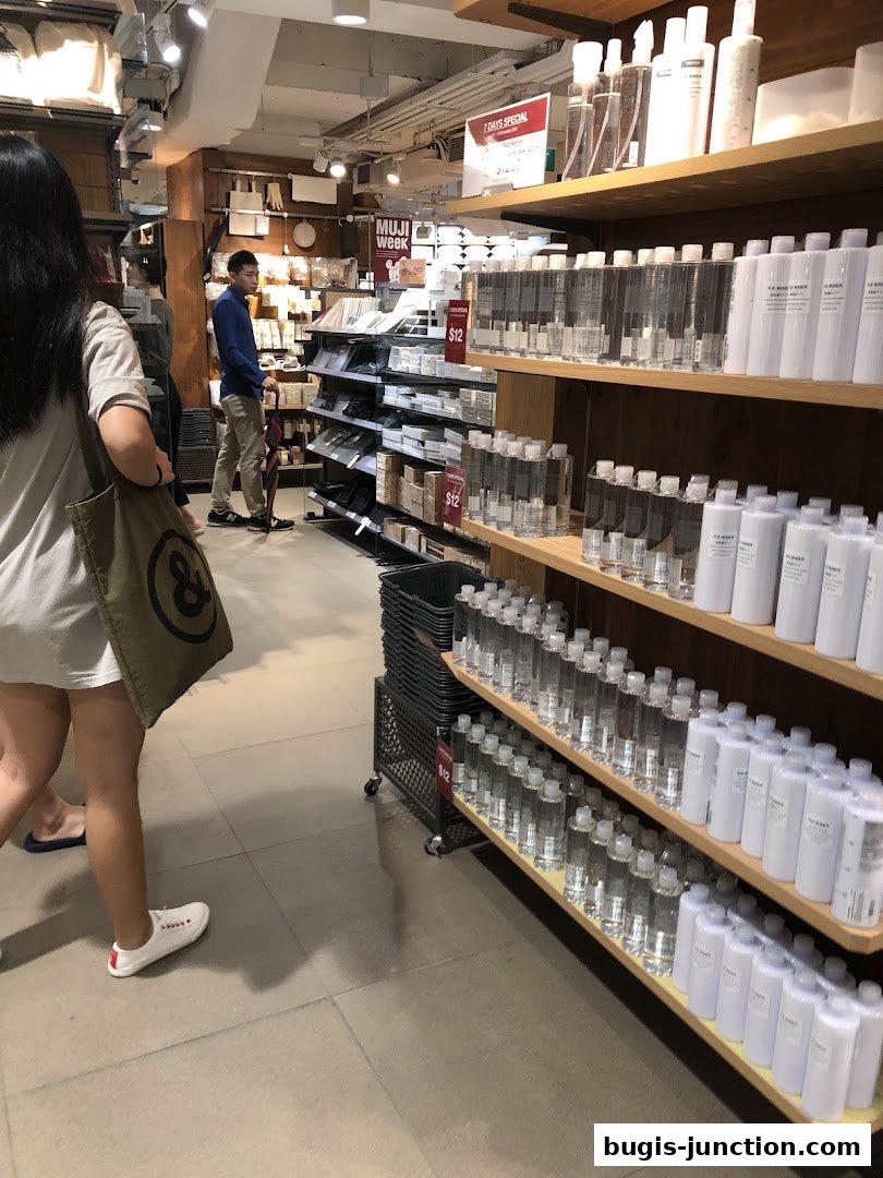 Interior view of a MUJI store showcasing skincare products and home goods.