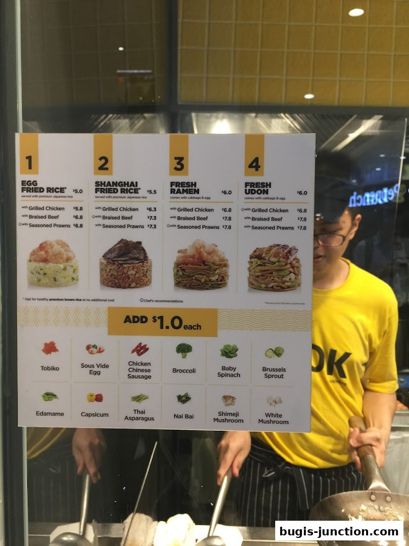 A menu board for Wok Hey Bugis Junction, showcasing various fried rice and noodle dishes with customization options.