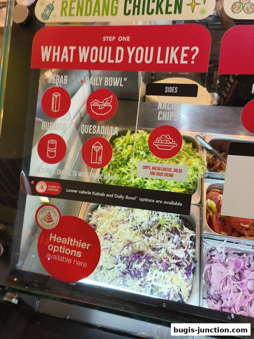A display showing options for building a meal, including Kebab, Daily Bowl, Burrito, and Quesadilla.