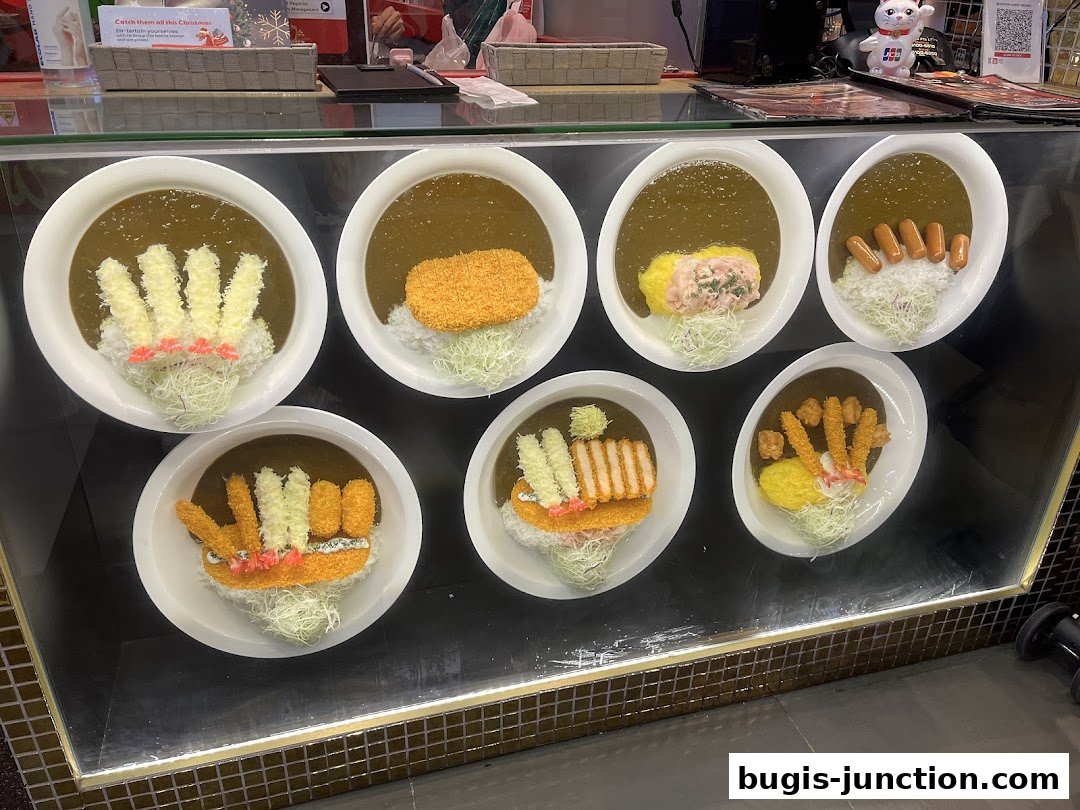 A display of various Japanese curry dishes with creative rice presentations.