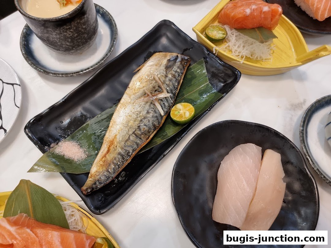 A spread of delicious Japanese dishes including grilled fish, sashimi, and chawanmushi.