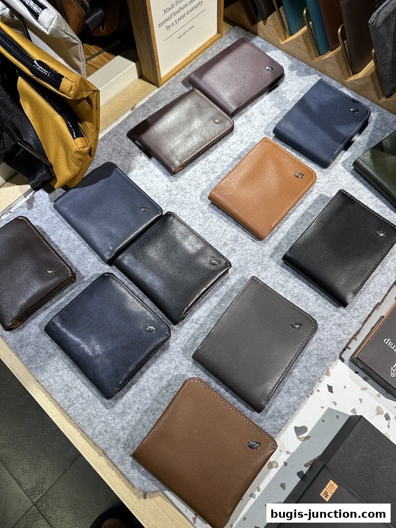 A display of various leather wallets in different colors and styles.