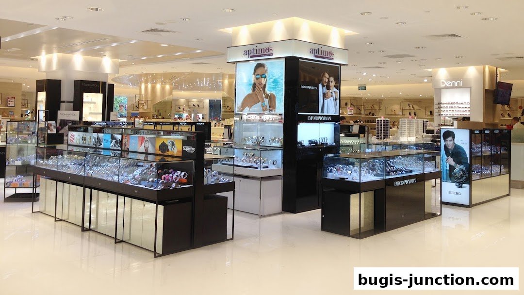 A well-lit retail store interior showcasing a wide selection of watches in display cases.