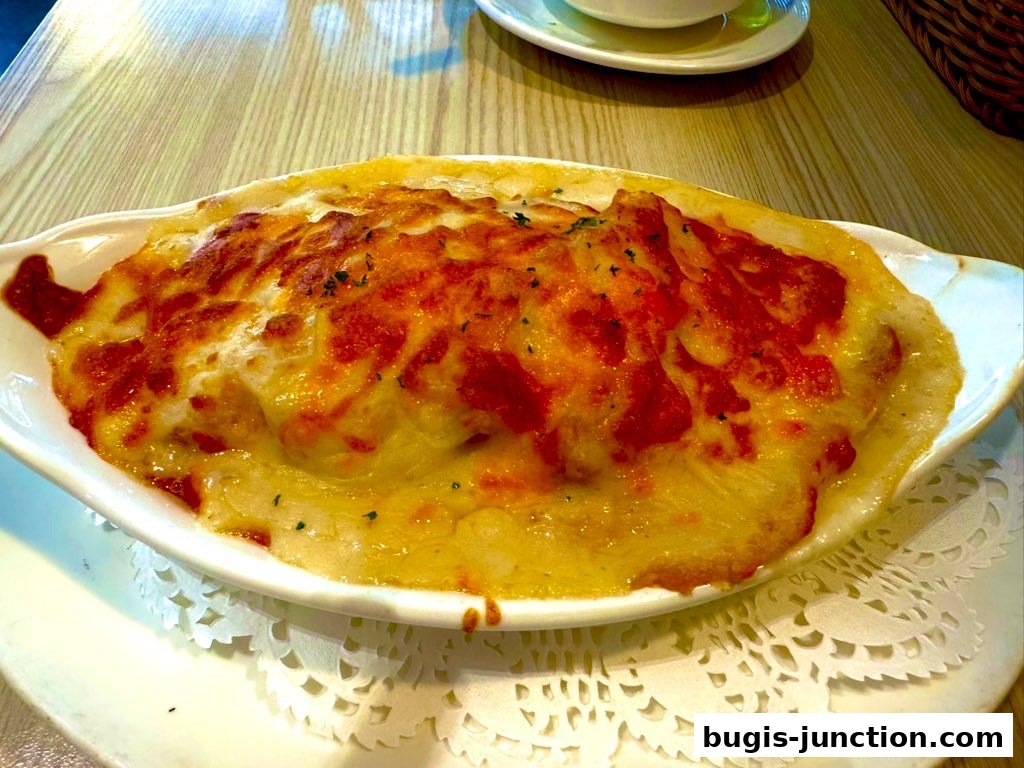 A close-up shot of a delicious baked dish with melted cheese and herbs.