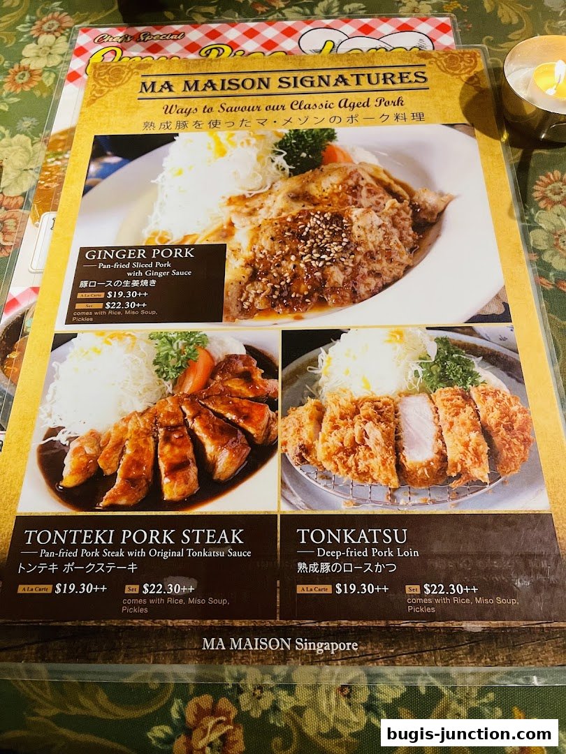 A menu from Ma Maison featuring signature aged pork dishes like Ginger Pork, Tonteki Pork Steak, and Tonkatsu.