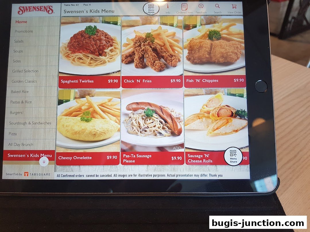 A tablet displaying Swensen's Kids Menu with various food items and prices.