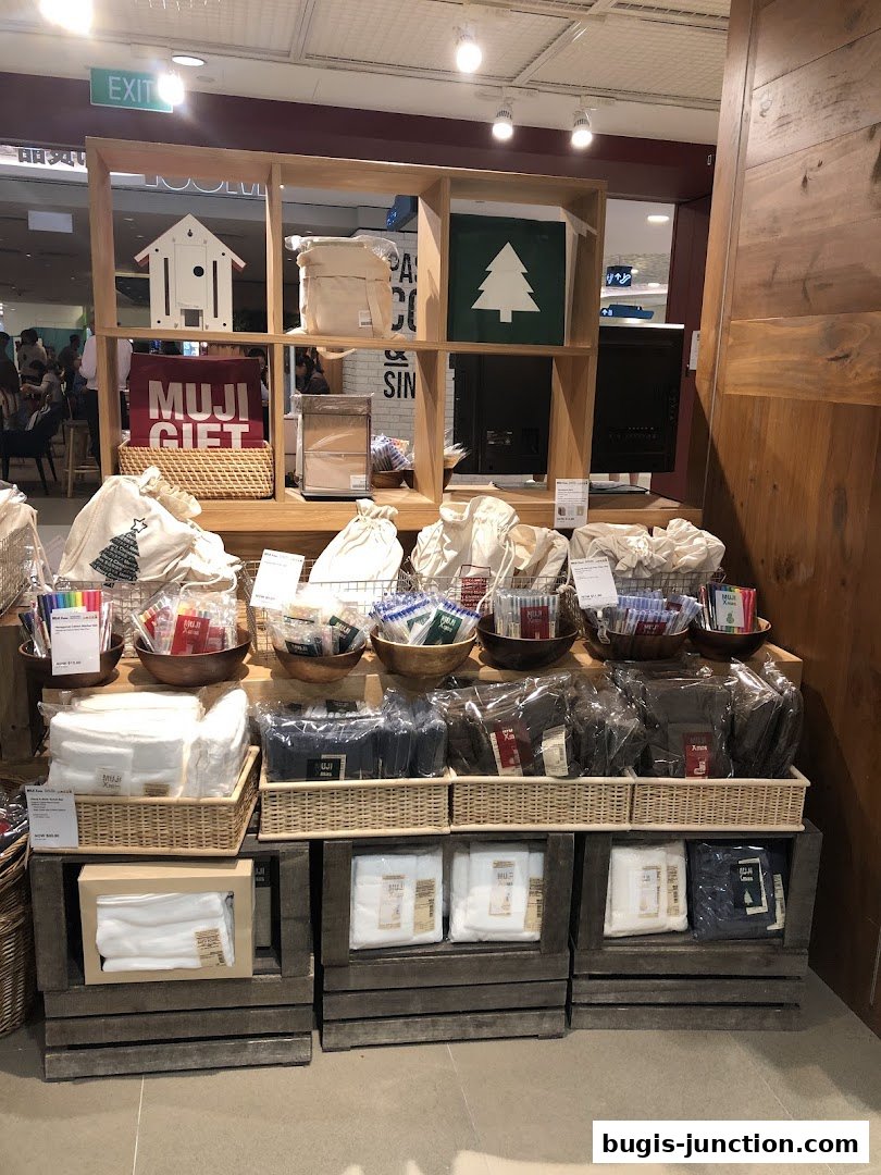 MUJI Bugis Junction shop interior displaying various gift items and home goods.