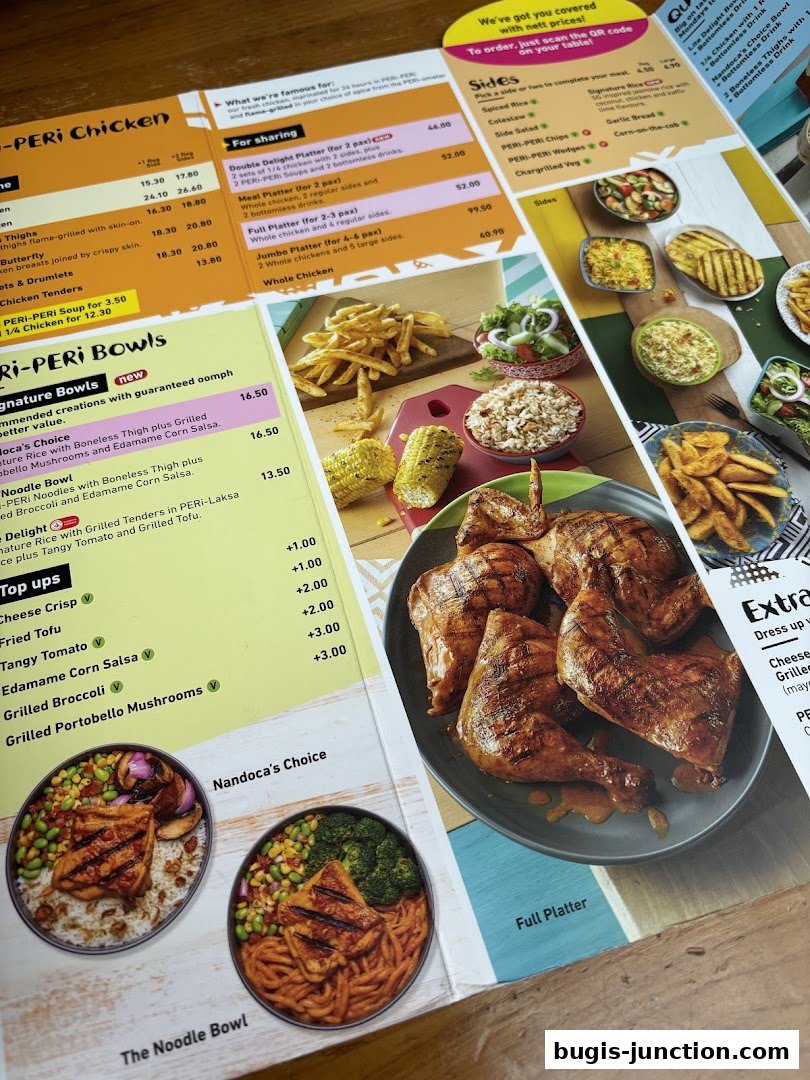 A close-up view of a Nandos menu featuring flame-grilled chicken and various side dishes.