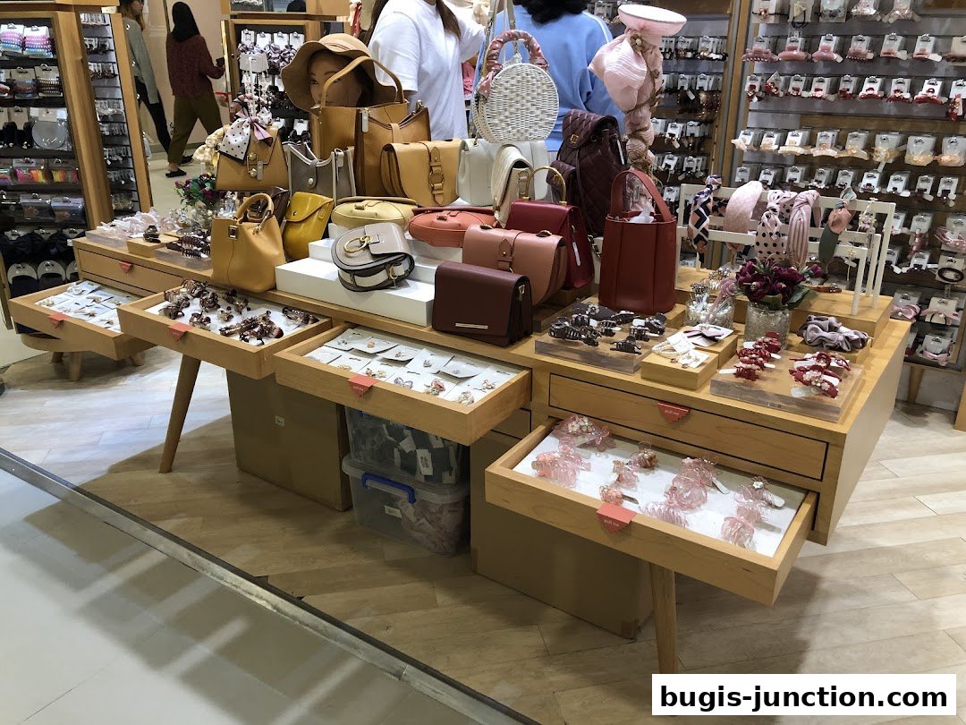 A display of handbags and hair accessories in a retail store.