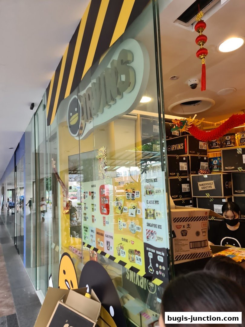The IRVINS shop front displays its popular snacks and gift boxes through its glass window.