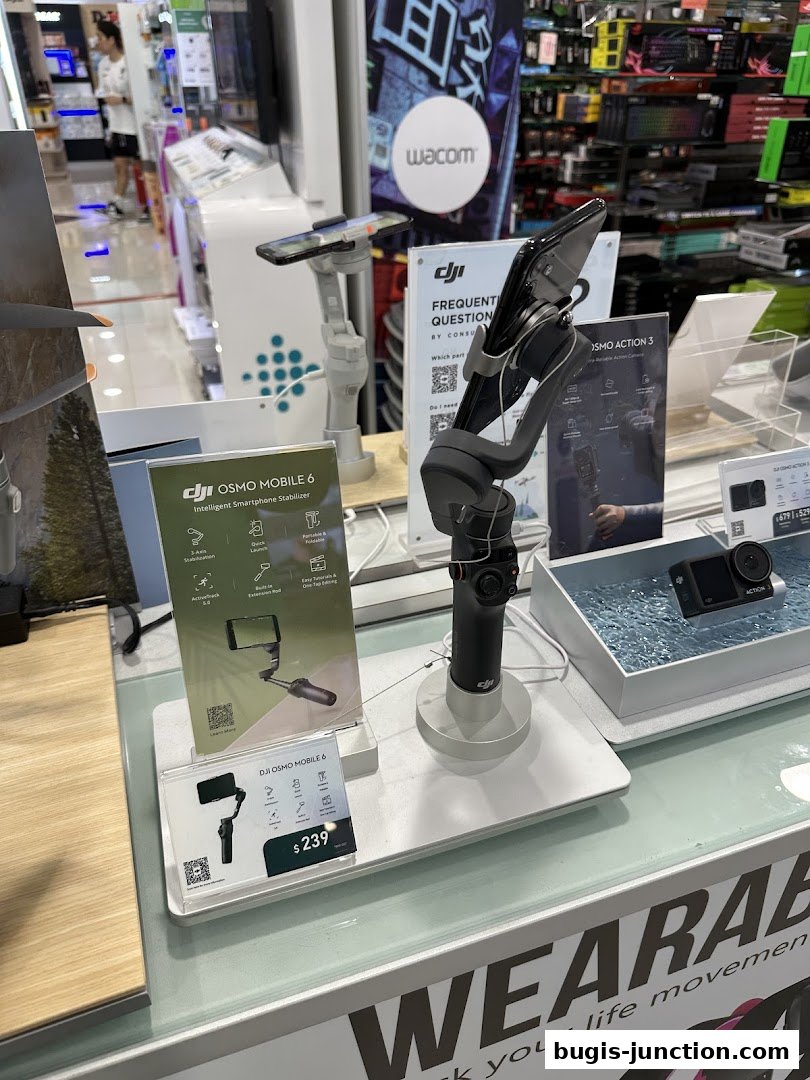 Display of DJI Osmo Mobile 6 and Action 3 cameras at Challenger store.
