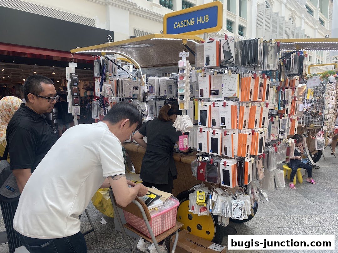 A stall named Casing Hub displays a wide variety of phone cases and accessories.