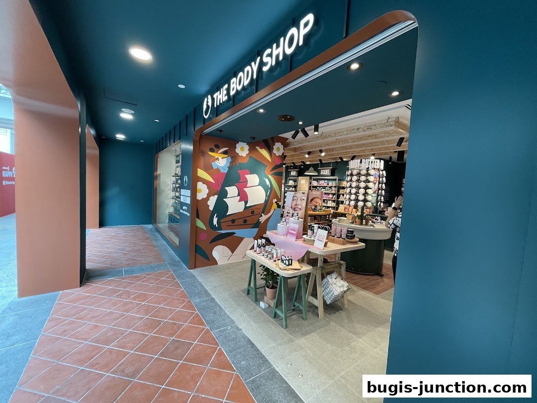 The Body Shop storefront with colorful artwork and displayed beauty products.