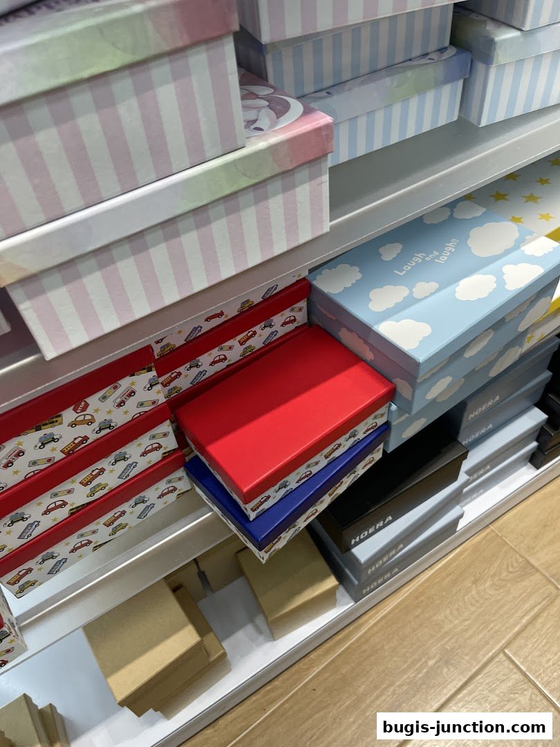 Shelves filled with various decorative boxes, some with playful patterns.