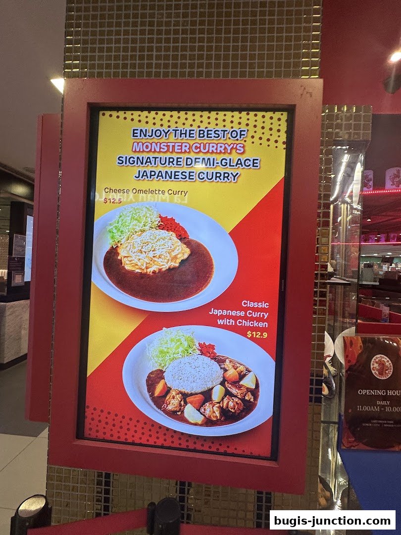 A digital menu board showcasing Monster Curry's signature Japanese curry dishes.